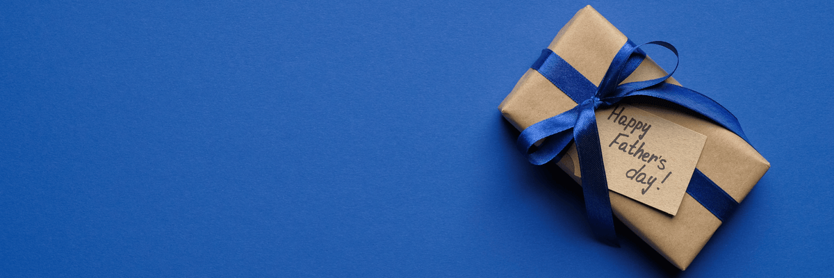 Father's Day gift box on blue backdrop