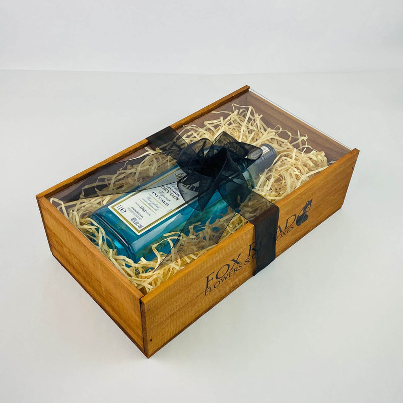 Bombay Sapphire dry gin inside wooden gift crate