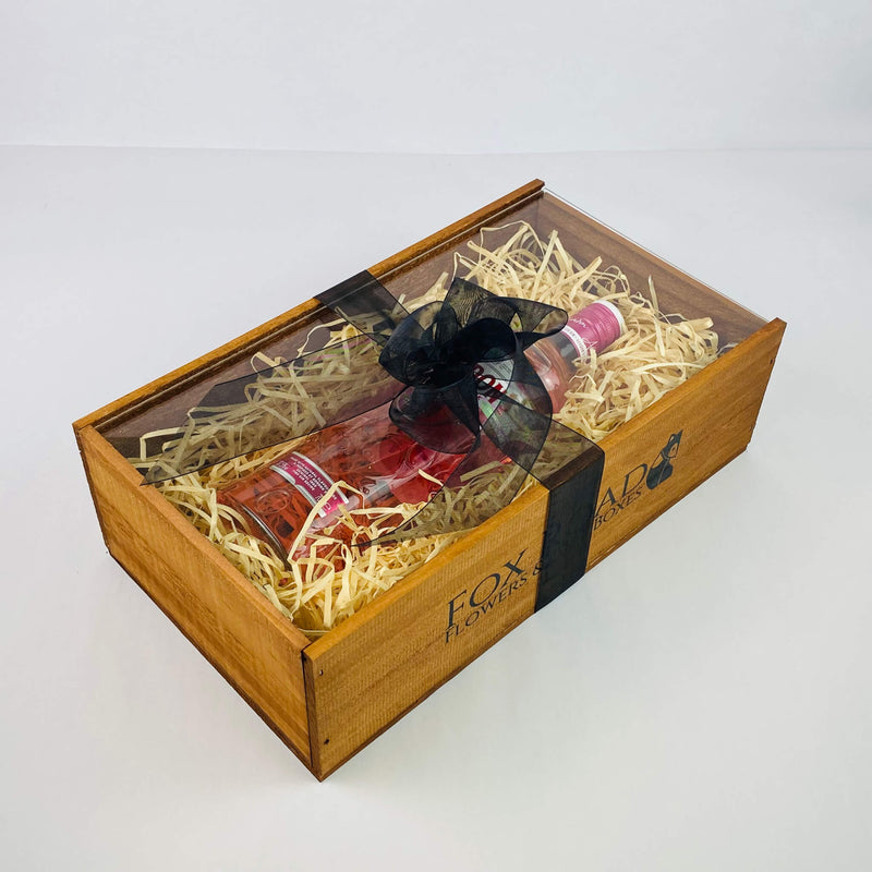 Gordons Pink Gin inside wooden gift box with black ribbon