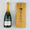 Bollinger French Champagne next to wooden gift box