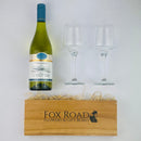Oyster Bay Marlborough Chardonnay with glasses besides wooden gift box
