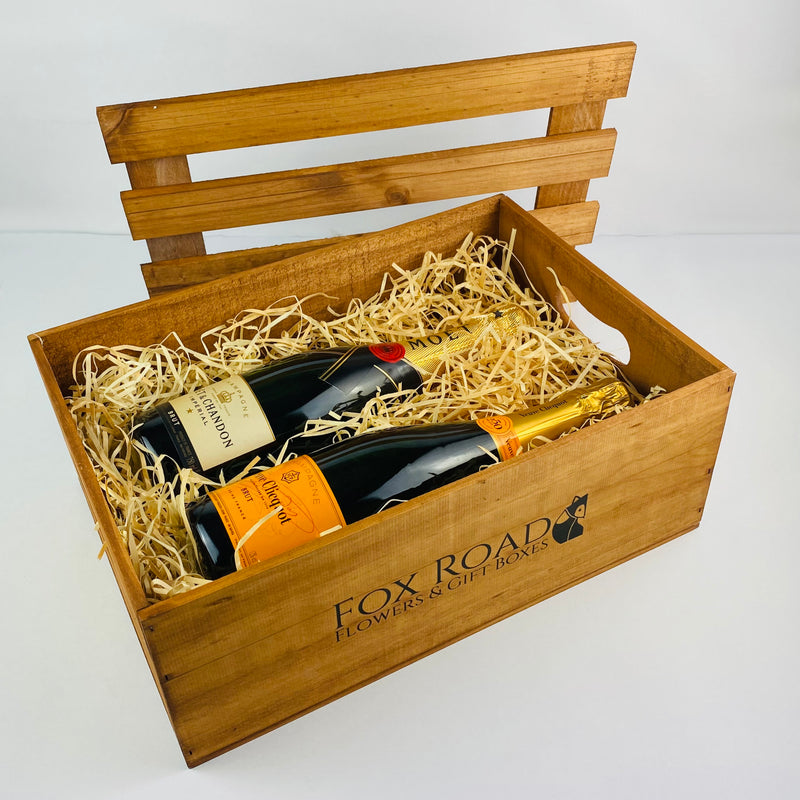 Two bottles of French Champagne inside wooden gift box
