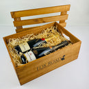 Champagne bottles inside wooden gift hamper