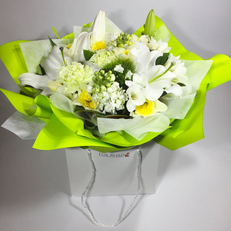 Lilies and white flowers for sympathy occasion