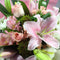 Wellington florist Jocelyn holding lilies and roses