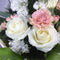 Close up of Wellington florist preparing white roses