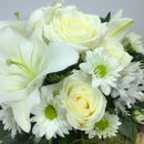 Close up of Lilies, Roses and Wellington florist