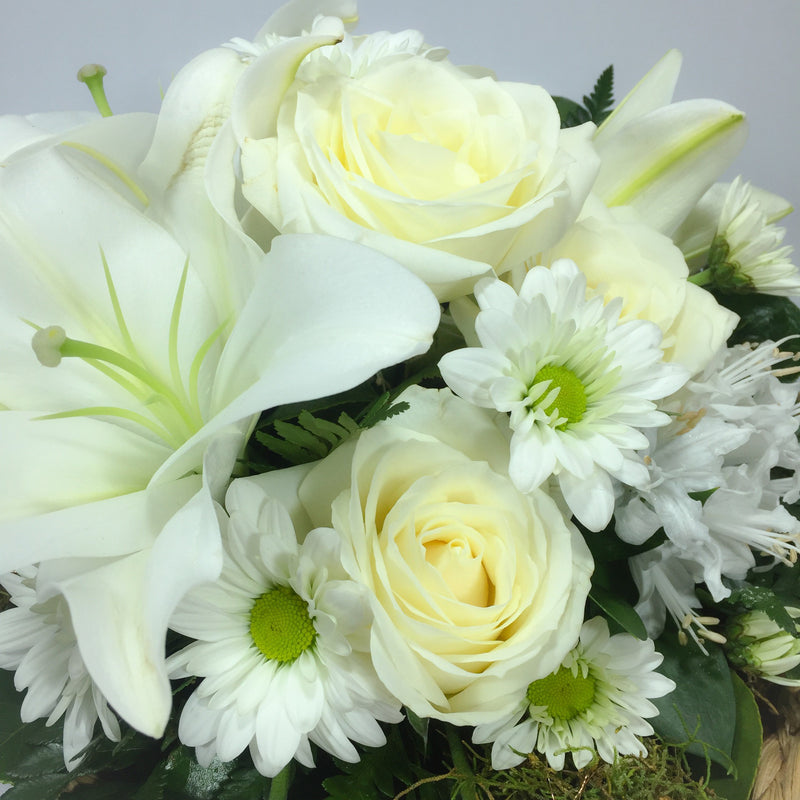 Close up of Lilies, Roses and Wellington florist