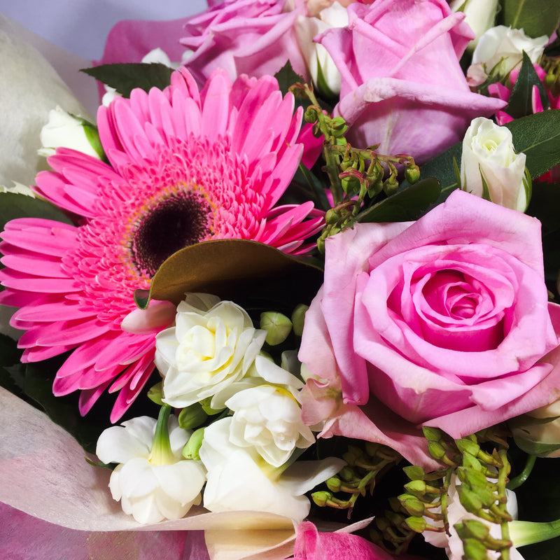 Close up of pink roses and other flowers