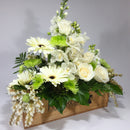 Florist with gift for sympathy flowers