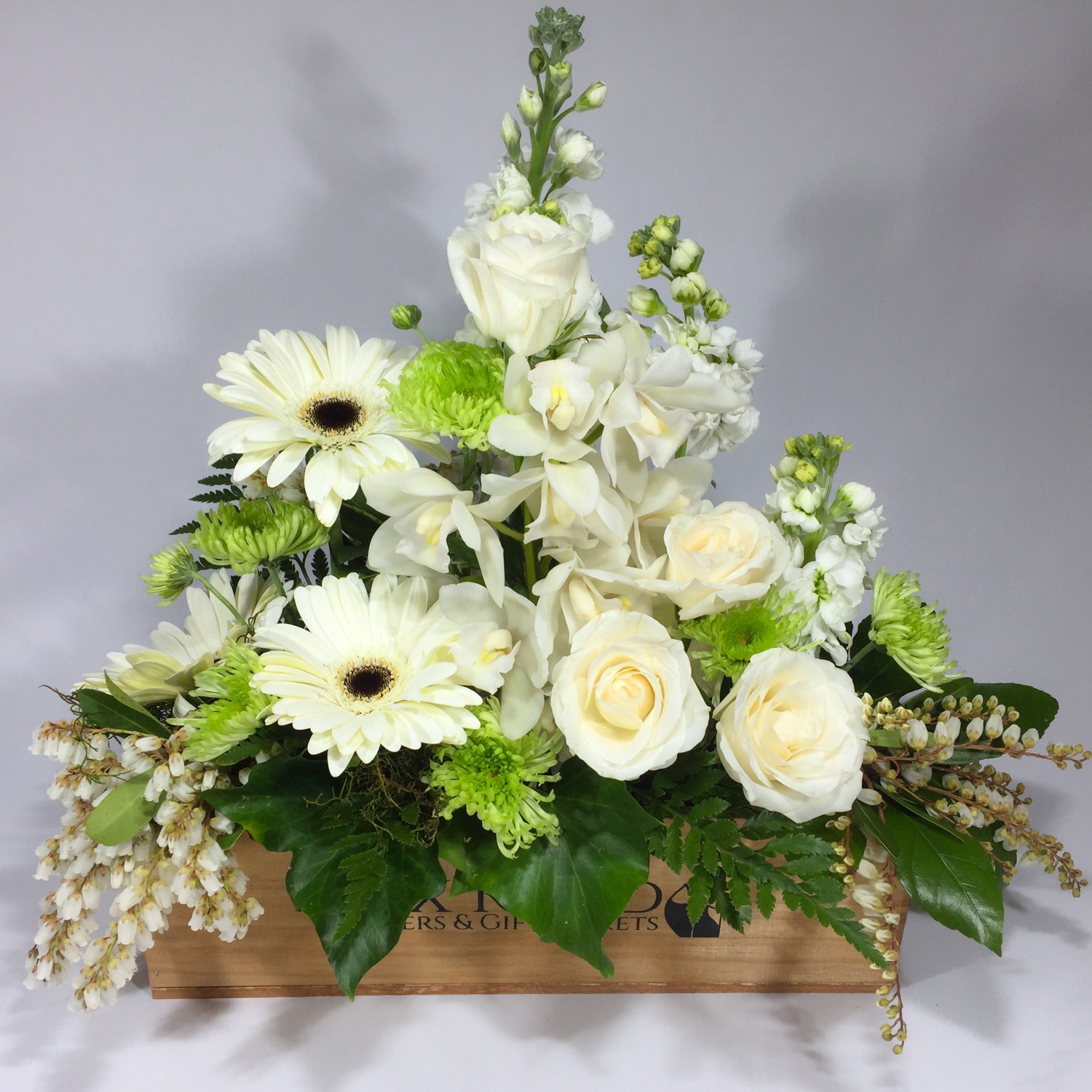 Funeral flowers in a wooden box