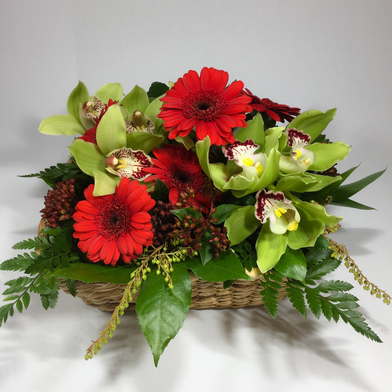 Flower basket with red and white gerberas