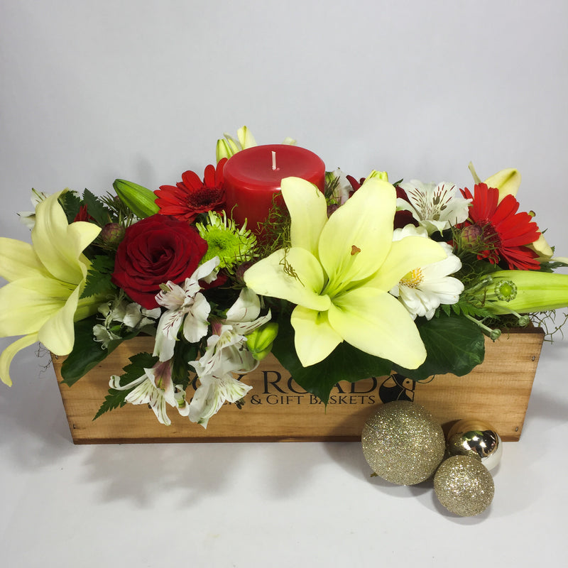 Christmas candle flowers with lilies and roses