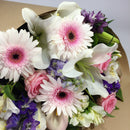 Close up of flower arrangement filled with gerberas and lilies