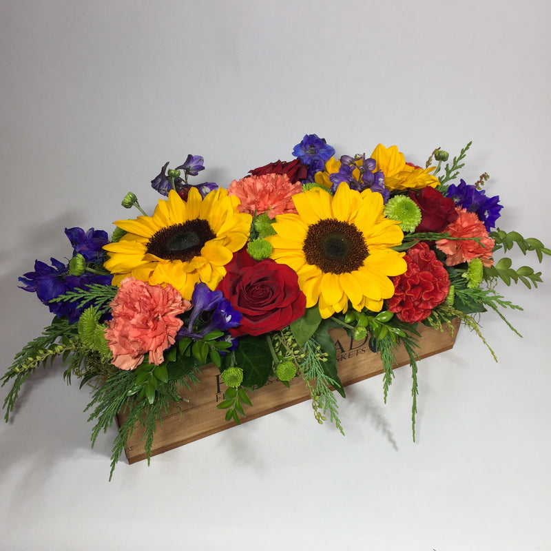 branded wooden crate with flowers