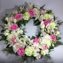 memorial wreath with pink and white flowers