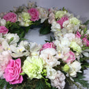 close up of wreath with funeral flowers