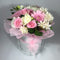 Pastel coloured fresh flowers in a hat box