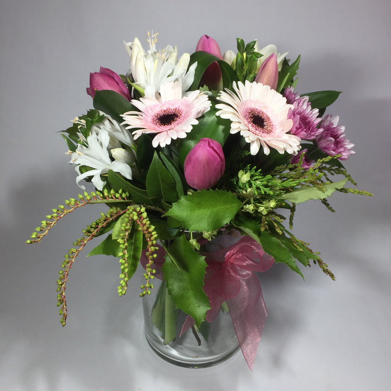 vase flowers with gerberas, tulips and greenery
