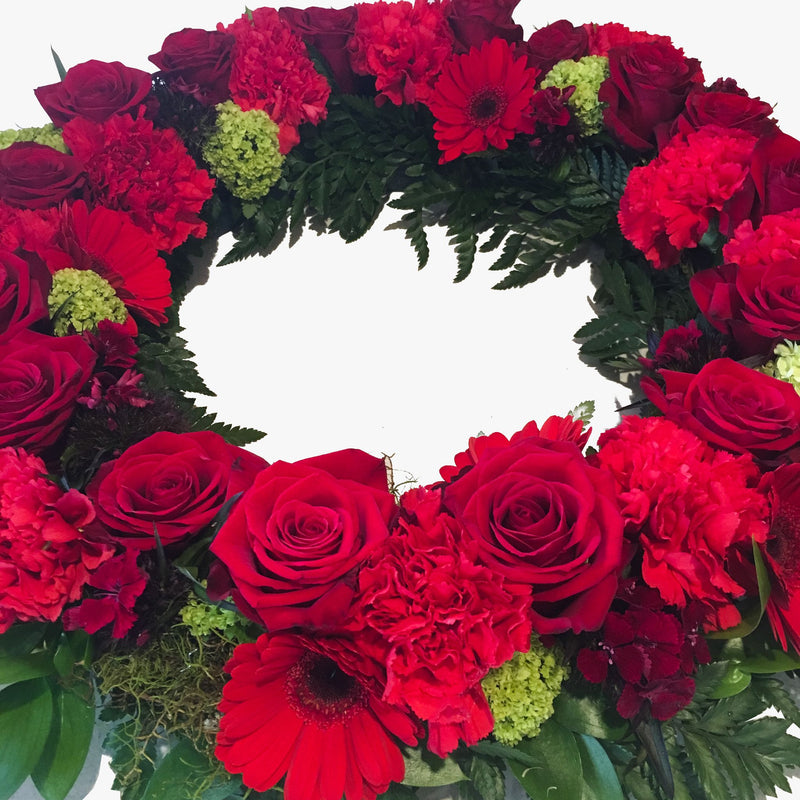 ANZAC Day wreath with red and green flowers