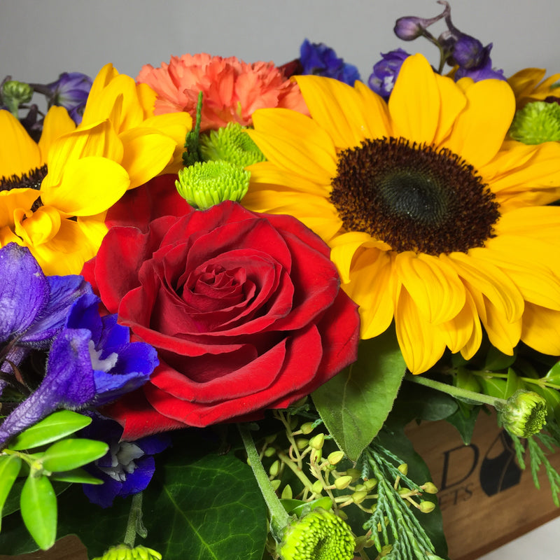 Sunflowers and bright red roses for her birthday