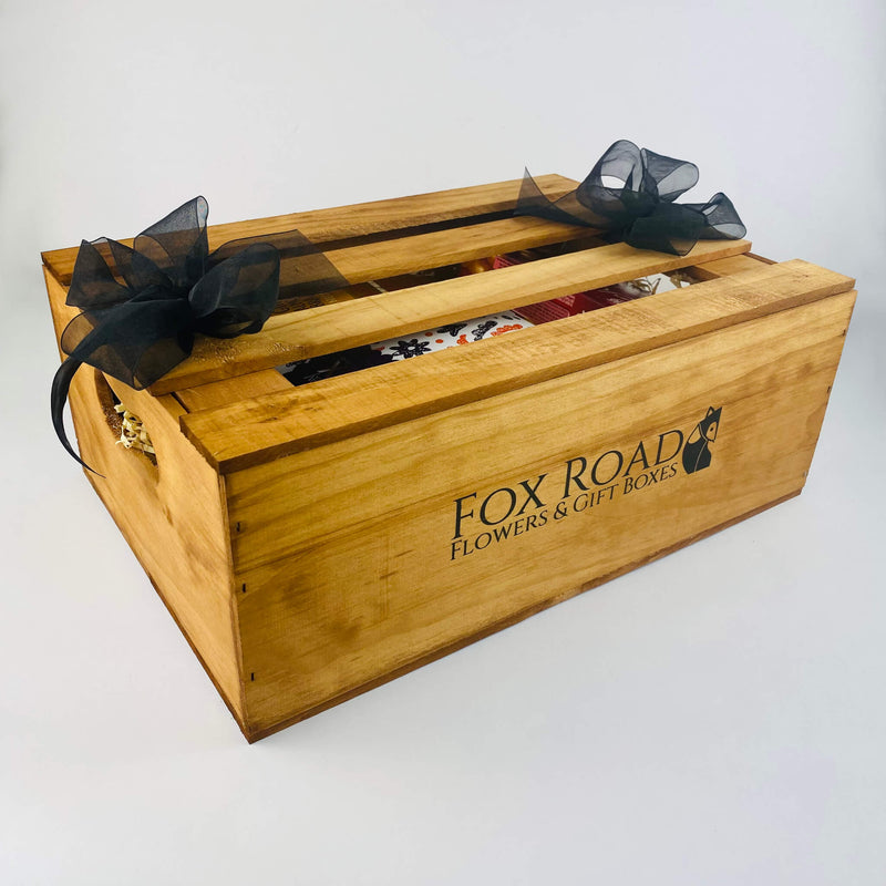 Wooden gift hamper with Wine and chocolates.