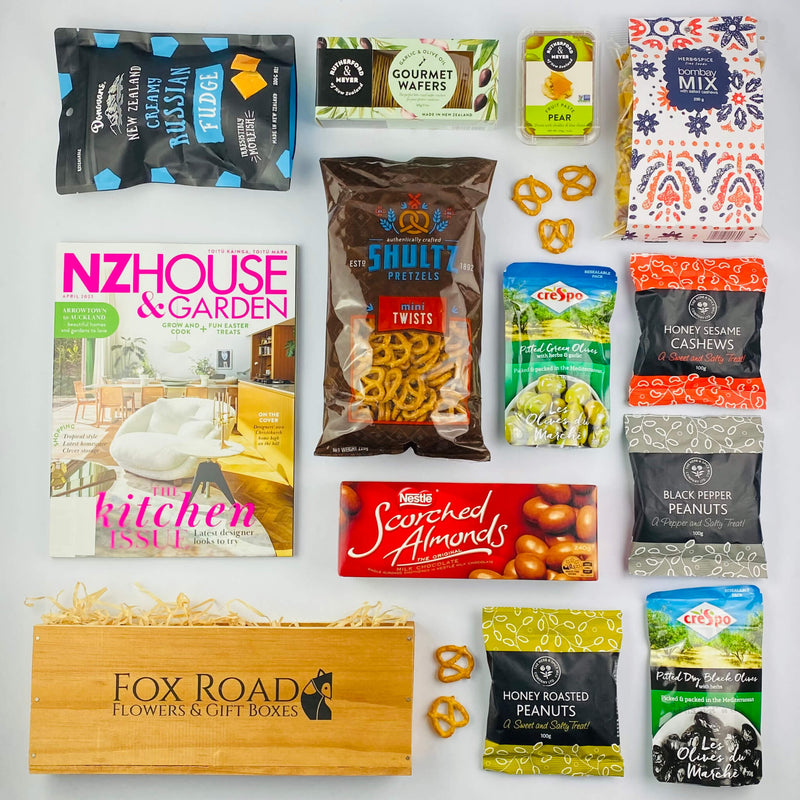 NZ House & Garden Magazine with snacks by wooden gift box.